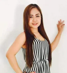 Professional Thai massage therapist delivering relaxing spa treatment
